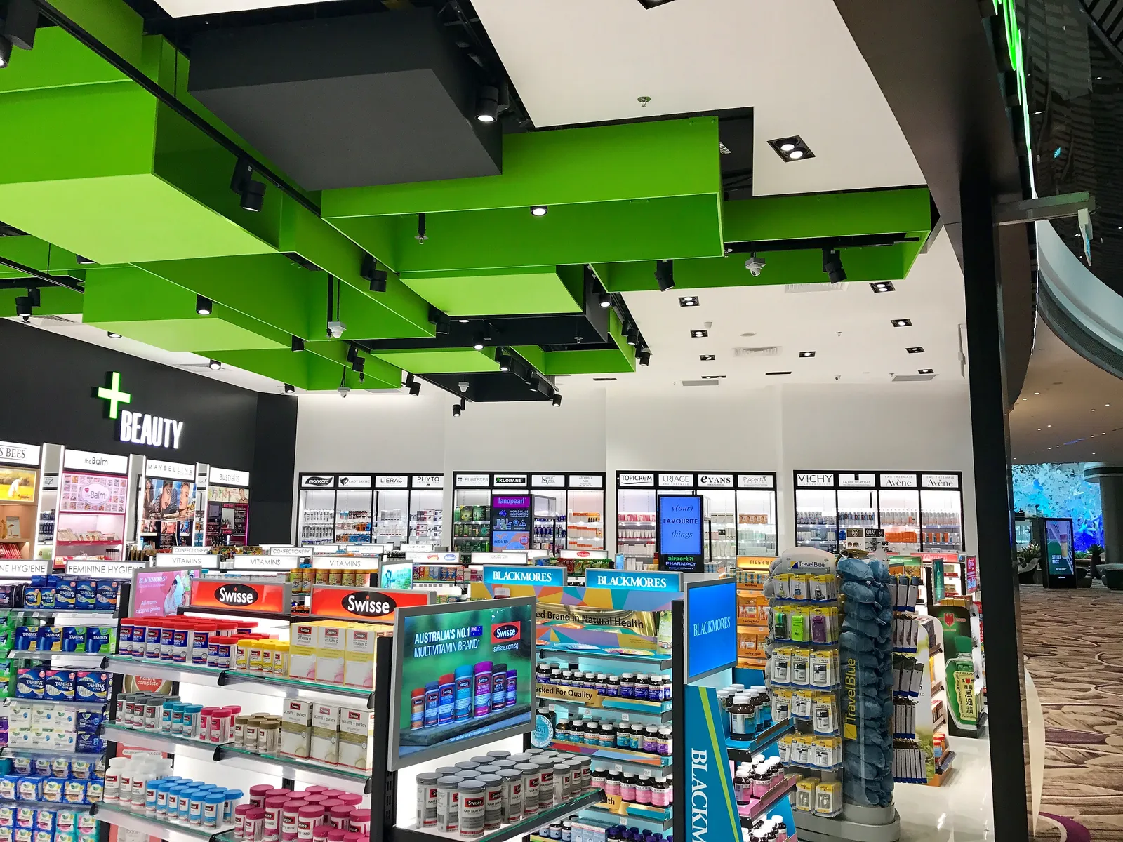 Vitamin and wellness aisles with Australian brands at Airport Pharmacy Changi T4